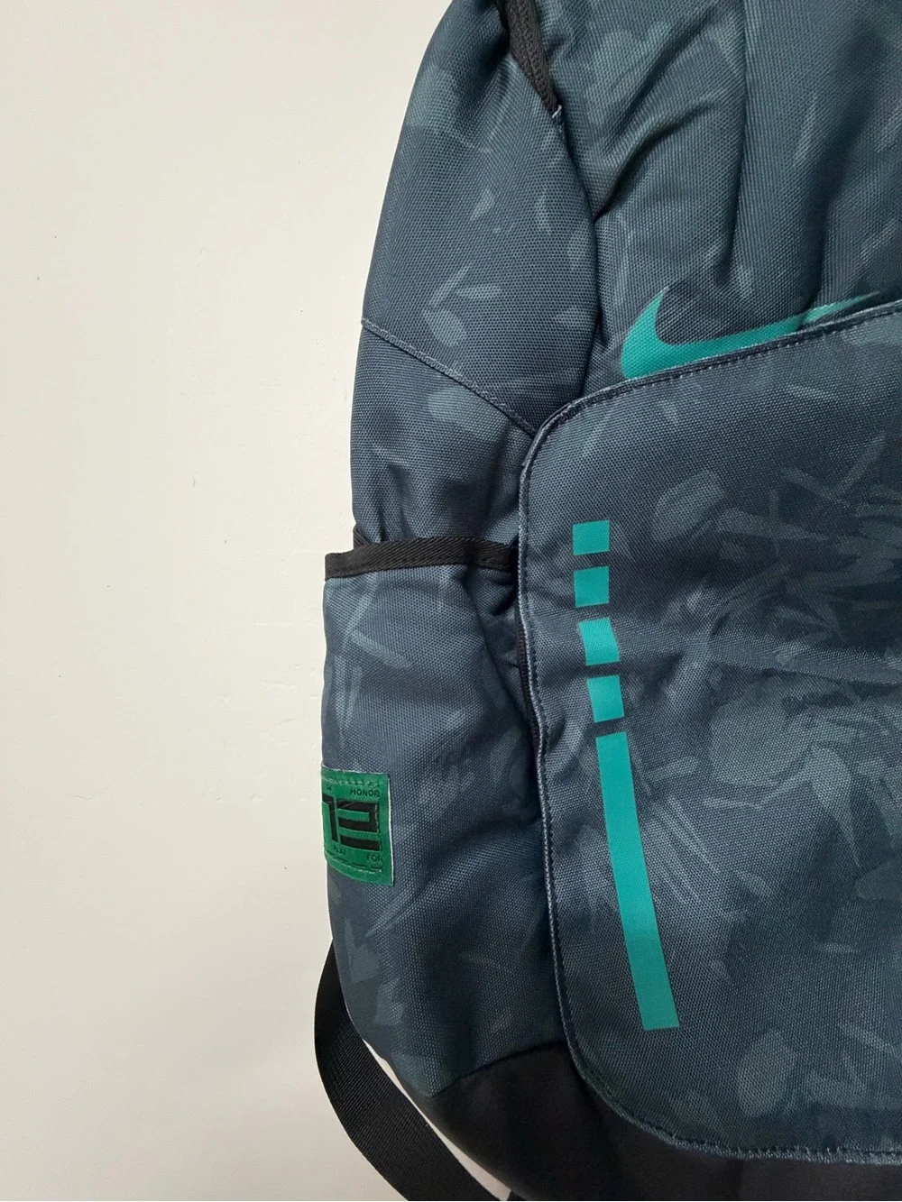 Nike Men's Dark Gray Backpack with Teal Accents